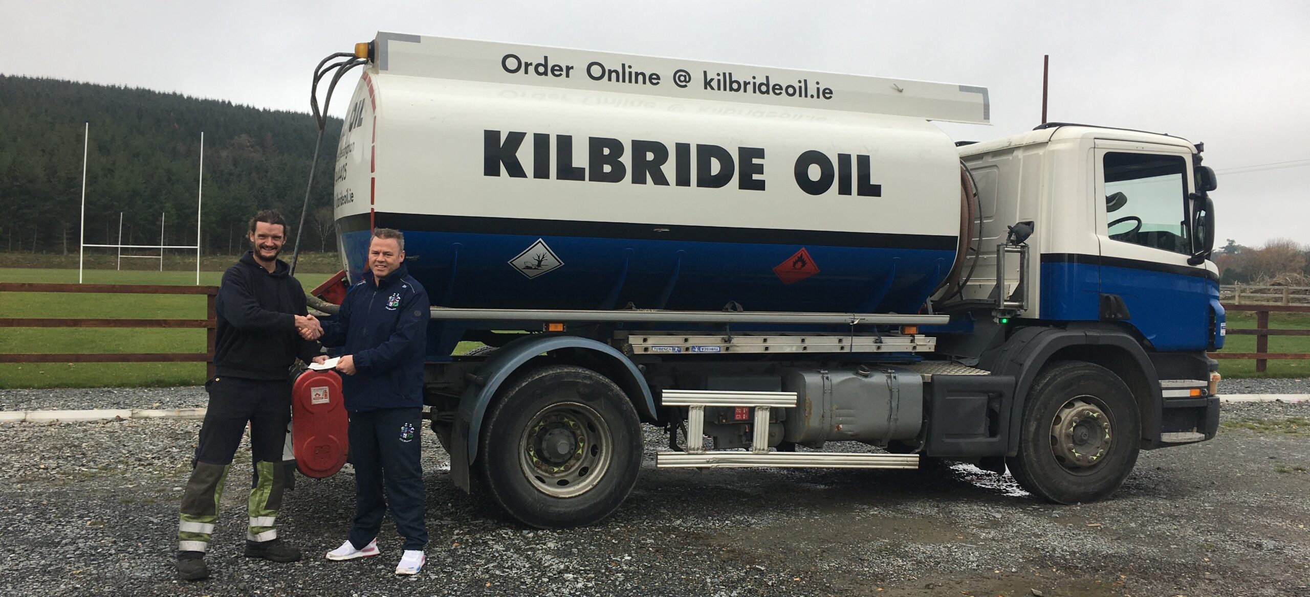 Chairman Diarmuid Haughian with Kilbride Oil's Adam Kiernan